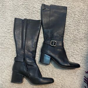 black heeled boots with buckle detailing